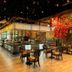 Fairmont Austin Gold Experience lounge with central bar and dining tables in Austin