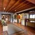 Hotel-Apartamento Rural Atxurra in Bermeo lobby with wood ceiling, stone walls, and reception desk