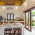 Villa Leelavadee South Kuta villa kitchen with island, dining table, and sliding doors to garden