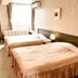 Resort Inn Marion Shinano in Hakuba guest room with two twin beds and window view