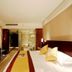 Home Inn Da Mu Qiao Shanghai guest room with king bed and glass-walled bathroom
