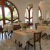 Hotel Parco Conte dining room in Casamicciola Terme with set tables and arched windows