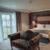 Dunadry Hotel And Gardens Antrim guest room with king bed, armchair, and balcony doors