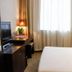 Beijing Northern Langyue Hotel Financial Street Branch guest room with TV, desk and window curtains in Beijing
