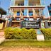 Hotel Sagar Kanya Inn in Puri, exterior with Multicuisine AC restaurant signage and balconies