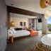 Secrets Tulum Resort And Beach Club suite with king bed, balcony, and jungle view in Tulum