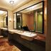Shangmao International Hotel in Nanjing bathroom with double sinks, large mirror, and glass shower