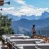 Hotel Olangerhof in Valdaora terrace with lounge seating and mountain views
