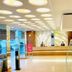 Hotel Centre Point in Nagpur lobby with circular ceiling lights, front desk, and glass railing