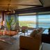 Four Seasons Resort Lanai suite with ocean view, balcony seating, and glass coffee table in Lanai City