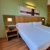 Hotel La Boroña in Gijón: double room with twin beds, green accent wall and sliding wardrobe