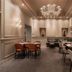 WorldHotel Casati 18 in Milan: elegant hotel restaurant with chandelier and set dining tables