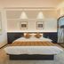 Beijing Lian Jie Hotel room with king bed, framed art, and floor-to-ceiling window in Beijing