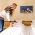 Aktiv Hotel & Spa Hannigalp, Grächen: guest making a twin bed in a bright room