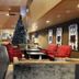 HG Alto Aragón lobby in Formigal with Christmas tree, red seating and modern open atrium