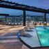 The Rally Hotel at McGregor Square in Denver rooftop pool with lounge chairs and city views