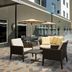 Outdoor pool patio at Residence Inn by Marriott Doral Mall Area in Doral with lounge seating and umbrellas