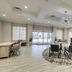 Homewood Suites by Hilton Charleston - Mt. Pleasant lobby seating area with circular rug and windows