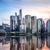 Pod Inn Shanghai Lujiazui with Shanghai skyline and waterfront reflections at sunset