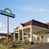 Days Inn by Wyndham Dillon hotel exterior with red-tiled roof and palm tree in Dillon