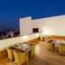 Ginger Jaipur rooftop terrace dining area with city views at dusk in Jaipur