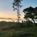 Erlittop Nature Lodge in El Nido with sunset sea views over lush greenery