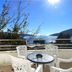 Apartments Villa Kukoljac in Herceg Novi balcony with table, chairs and sea view