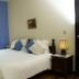 El Refugio Hotel & Spa in Sasaima, guest room with double bed, bedside lamp, and window view