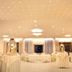 Hotel Il Gabbiano Beach in Terme Vigliatore banquet hall with round tables and ceiling lights