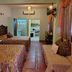 Hotel Marbella Playa Larga in Ixtapa guest room with two beds, sofa, TV and bathroom doorway