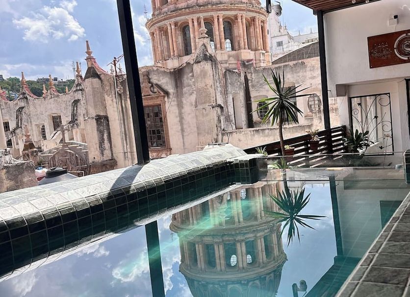 Hotel Casa del Sol Guanajuato rooftop pool with cathedral dome reflection and city view