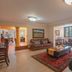 Sunward Park Guest House & Conference Centre lounge in Boksburg with sofas, coffee table and large windows