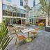 Outdoor courtyard dining area at City Express Plus by Marriott Ciudad de México Reforma El Ángel in Mexico City