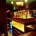 Mansouri Mansions Hotel, Manama bar with illuminated liquor bottles and beer taps
