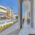 Hotel Borsalino in Porto, covered balcony corridor with wrought-iron door and street view