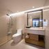 Yong Cun Hotel (Xi'an Bell Tower) bathroom with glass shower, toilet and vanity in Xi'an