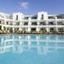 Club del Carmen in Tías with a large outdoor pool and white apartment-style balconies