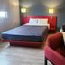 Hotel MX Forum Buenavista Cdmx guest room with bed, desk, chair and wall lamps in Mexico City