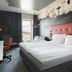Solo Sokos Hotel Torni Tampere room with large bed, city view window and desk in Tampere