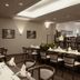 Ferien Appartements Am Berghotel Oberhof restaurant with set dining tables and seating in Oberhof