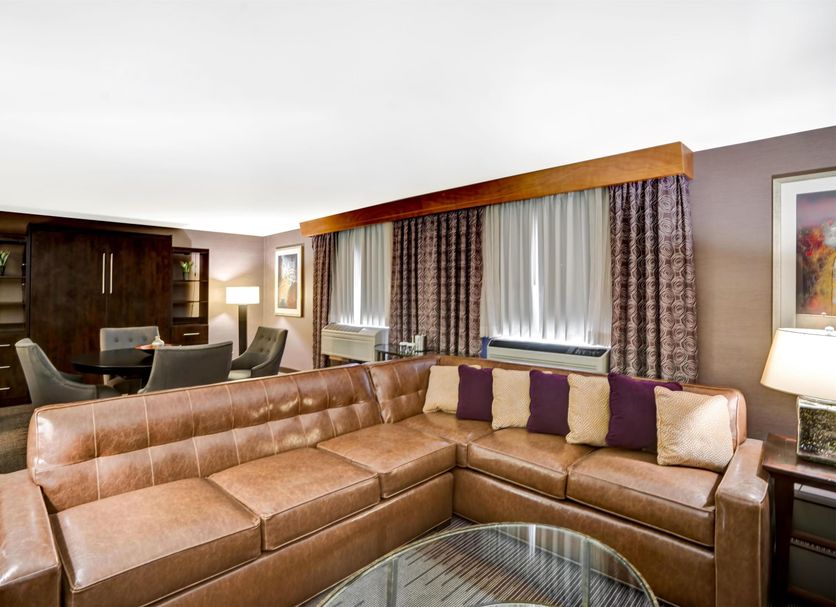 DoubleTree by Hilton Downtown Wilmington - Legal District suite with leather sectional and city view