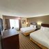 Sonesta Essential Hotels Overland Park guest room with two queen beds and a window view