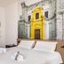 B&B Hotel Palermo Quattro Canti room with double bed and Palermo mural