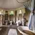 Glamping Canonici di San Marco in Mirano: luxury tent bathroom with bathtub, toilet, sink and wood floors