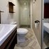 Camping Serenissima in Malcontenta: compact bathroom with shower, toilet, sink, and mirrored cabinet