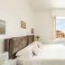 Guest House Maison 6 in Lido di Ostia bedroom with open window and sea view