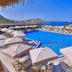 Samira Resort Hotel Aparts & Villas in Kalkan with a large outdoor pool, sun loungers and sea views