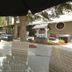 Clarion Pointe Medicine Hat outdoor patio with seating, umbrellas, and fire pits
