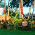 Vinh Suong Seaside in Phan Thiet, tropical garden with thatched hut, palm trees, and beach cart