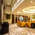 Wentou Oceanic Hotel Quanzhou lounge with ornate ceiling, yellow sofas and modern seating
